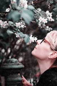 Portrait of woman with pink flowers