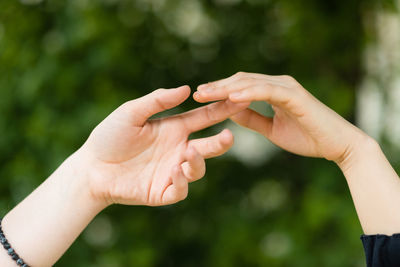 Close-up of couple holding hands