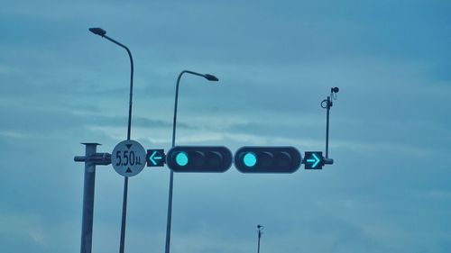 Low angle view of street light against sky