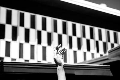 Close-up of hand on architecture structure