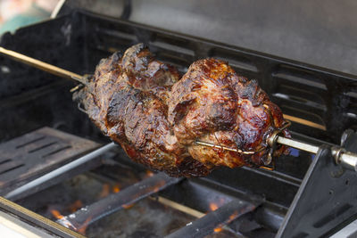 High angle view of meat on barbecue grill