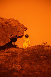 Portrait of an astronaut between rocks