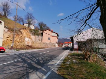 Street amidst buildings against sky