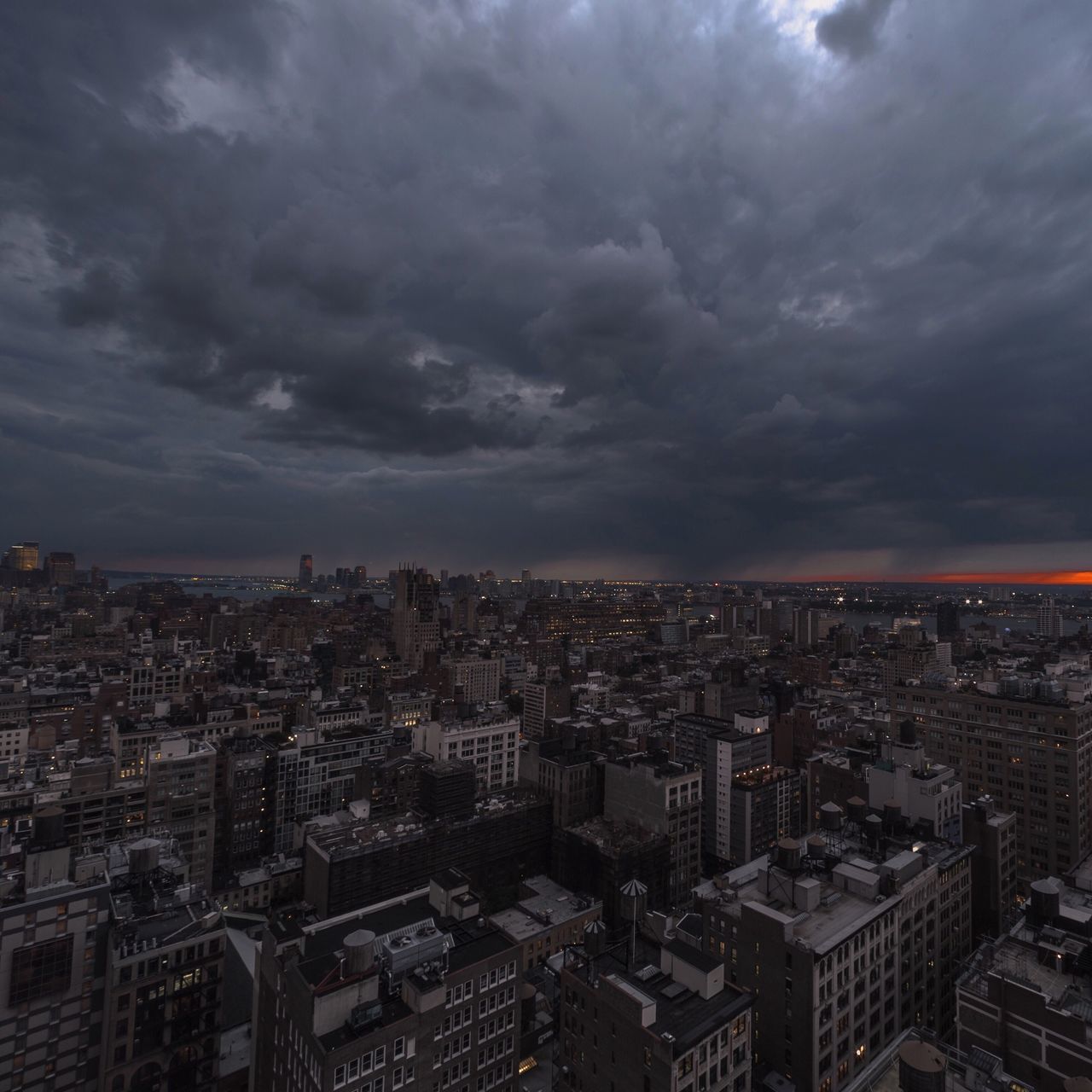 cityscape, city, building exterior, architecture, sky, cloud - sky, built structure, crowded, cloudy, high angle view, cloud, residential district, residential building, overcast, skyscraper, weather, city life, dusk, sunset, residential structure