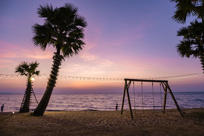 Scenic view of beach against sky during sunset