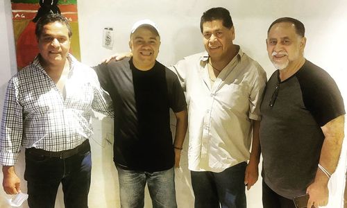 Group of people standing against wall