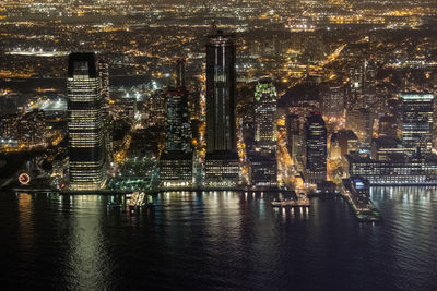 High angle view of illuminated buildings in city at night