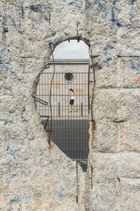 Man in front of building