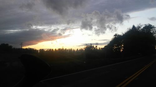 Scenic view of landscape against cloudy sky