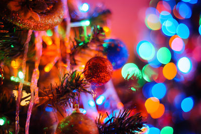 Close-up of illuminated christmas tree at night