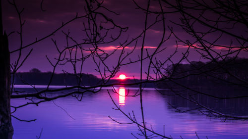 Scenic view of lake against romantic sky at sunset