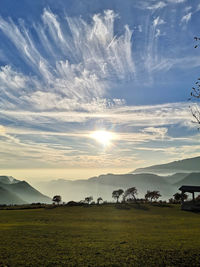 Scenic view of field against sky during sunset