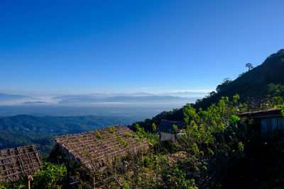 Scenic view of mountains against clear blue sky