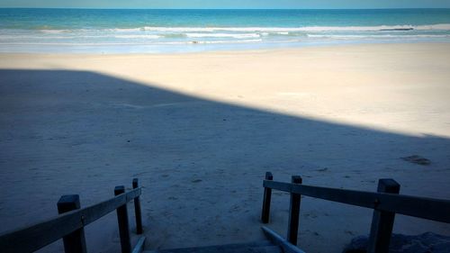 High angle view of beach by sea against sky