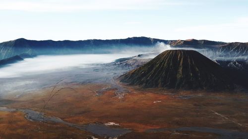 Panoramic view of volcanic landscape against sky