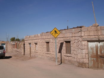 Information sign against clear sky
