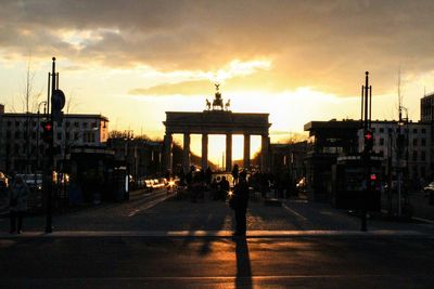 View of road against cloudy sky at sunset