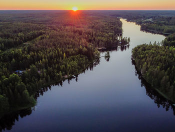 Scenic view of lake against sky at sunset