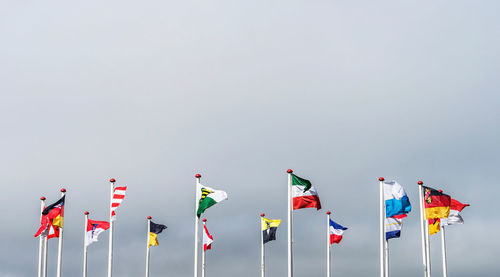 Colorful flags against clear sky