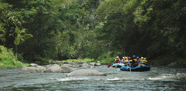 People rafting on river