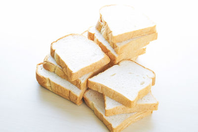 High angle view of bread on white background