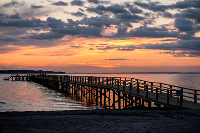 Scenic view of sea against orange sky