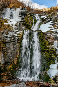 Scenic view of waterfall in forest