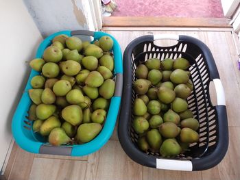 High angle view of fruits in basket on table