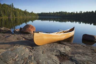 Low section of man in boat in lake