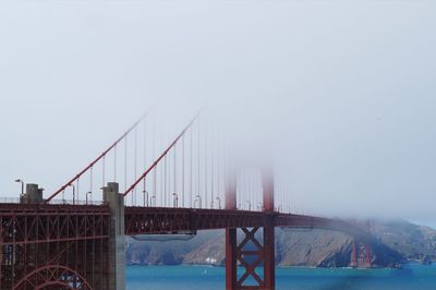 View of suspension bridge in foggy weather