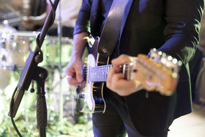 A musician plays the electric guitar during a live concert