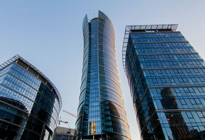 Low angle view of modern buildings against clear sky