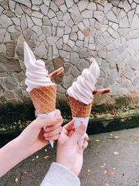 Midsection of person holding ice cream cone