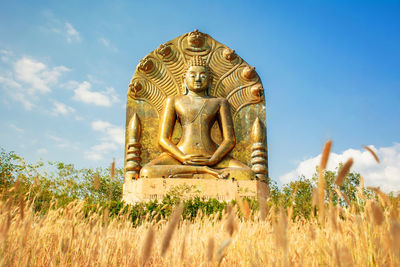 Low angle view of statue against sky