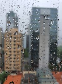 Full frame shot of wet glass window in rainy season