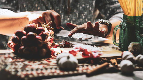 Close-up of hands on table