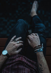 Midsection of man sitting on floor