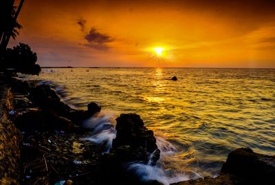 Scenic view of sea against sky during sunset