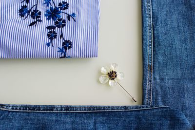 Directly above shot of blue clothes on white background