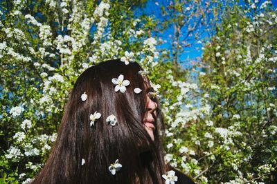 Close-up of woman against tree