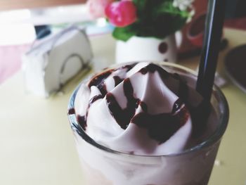 Close-up of ice cream in glass on table