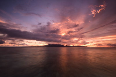 Sunrise with dramatic sky above volcano kolombangara by long exposure photo