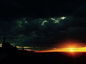 Scenic view of dramatic sky during sunset