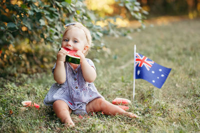 Girl sitting on land