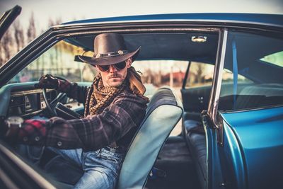 Man sitting in car