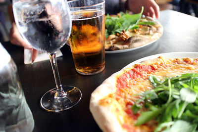 Close-up view of fresh pizza and beer