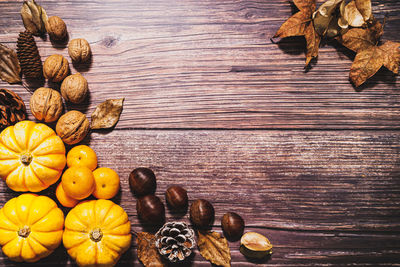 High angle view of fruits and leaves on table