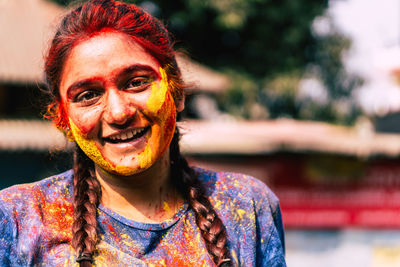 Close-up portrait of woman covered with powder paint