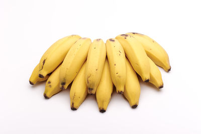 Close-up of bananas on white background