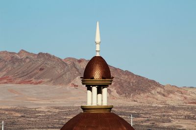 High section of temple against clear blue sky